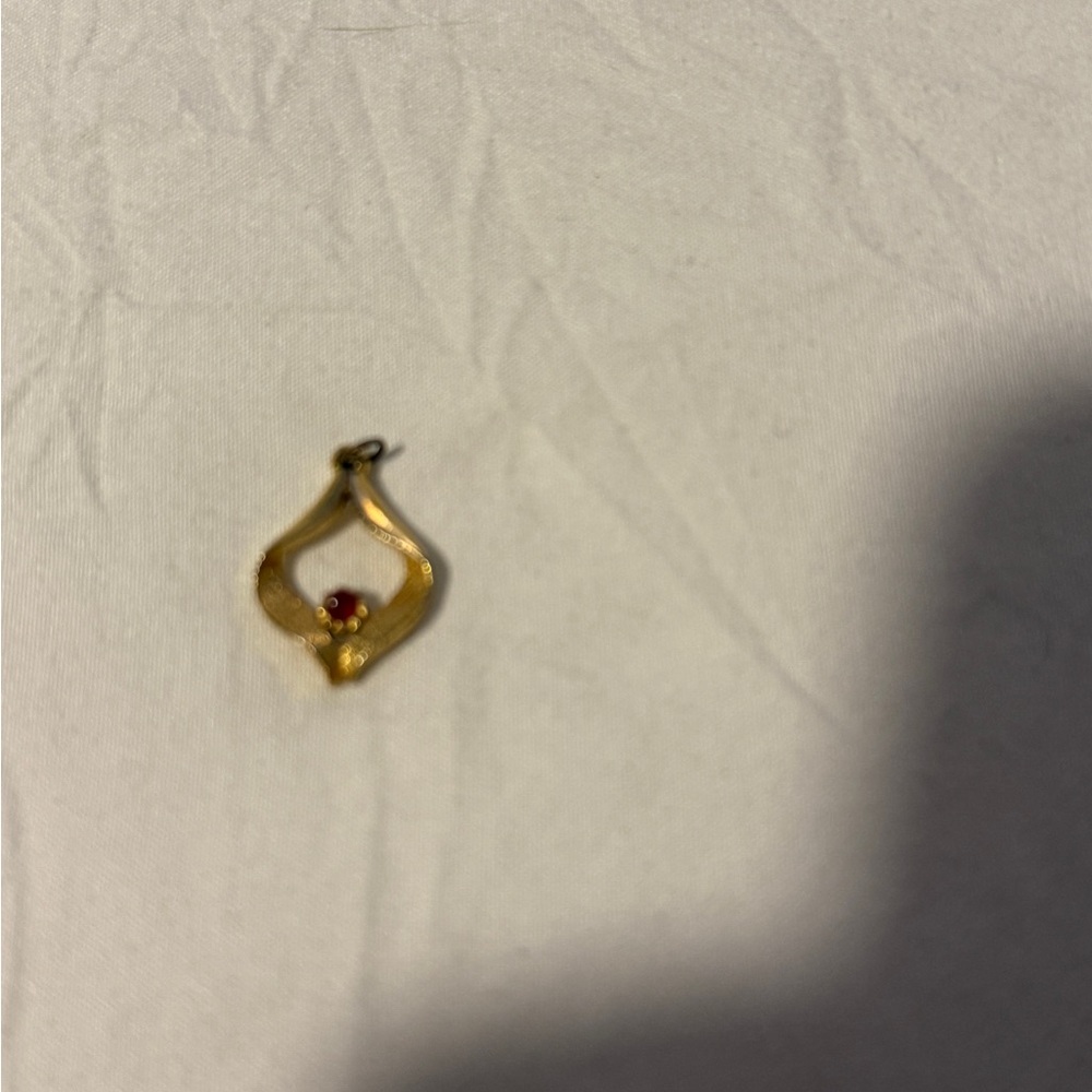 Elegant Gold Pendant Necklace with Red Accent